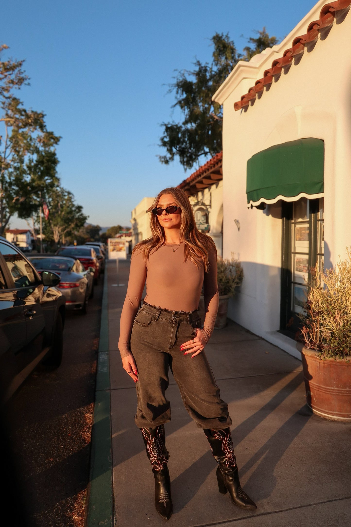buttery soft thin long sleeve crew neck bodysuit for women to shape curves on model Paige