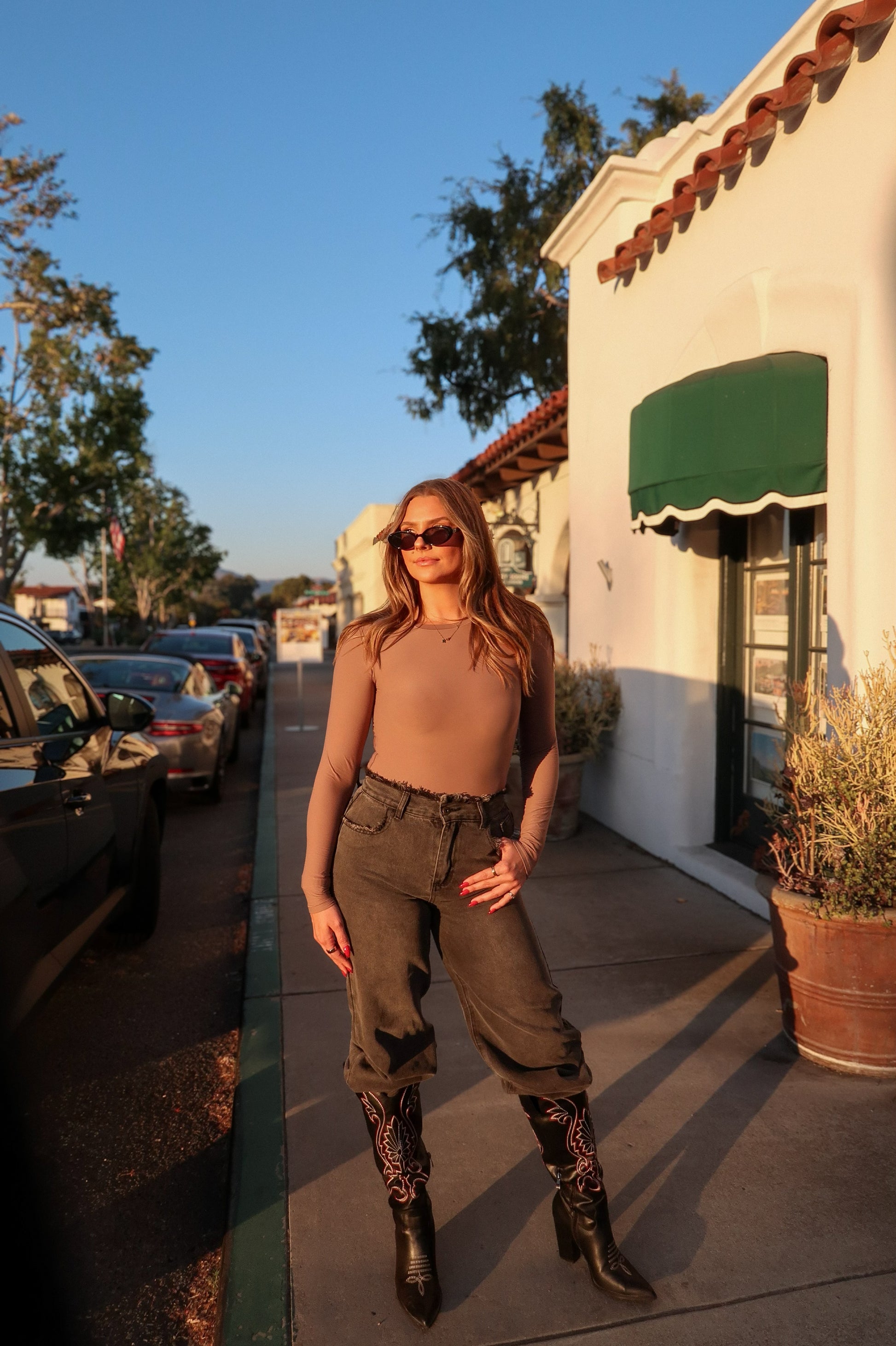 buttery soft thin long sleeve crew neck bodysuit for women to shape curves on model Paige