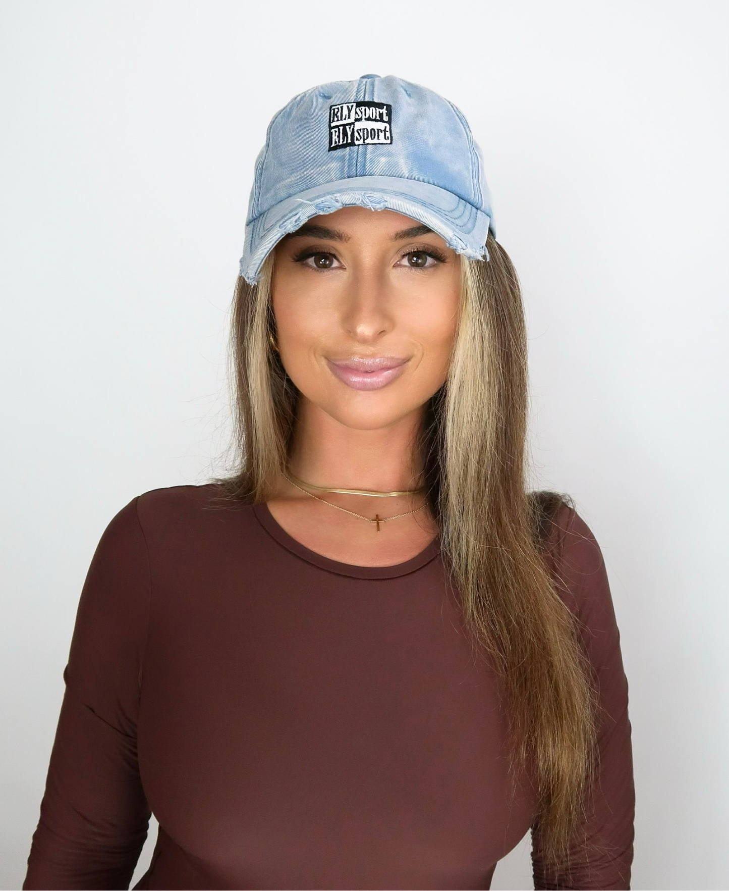Sporty Women’s blue denim distressed hat acid wash on model Eileen Hayman