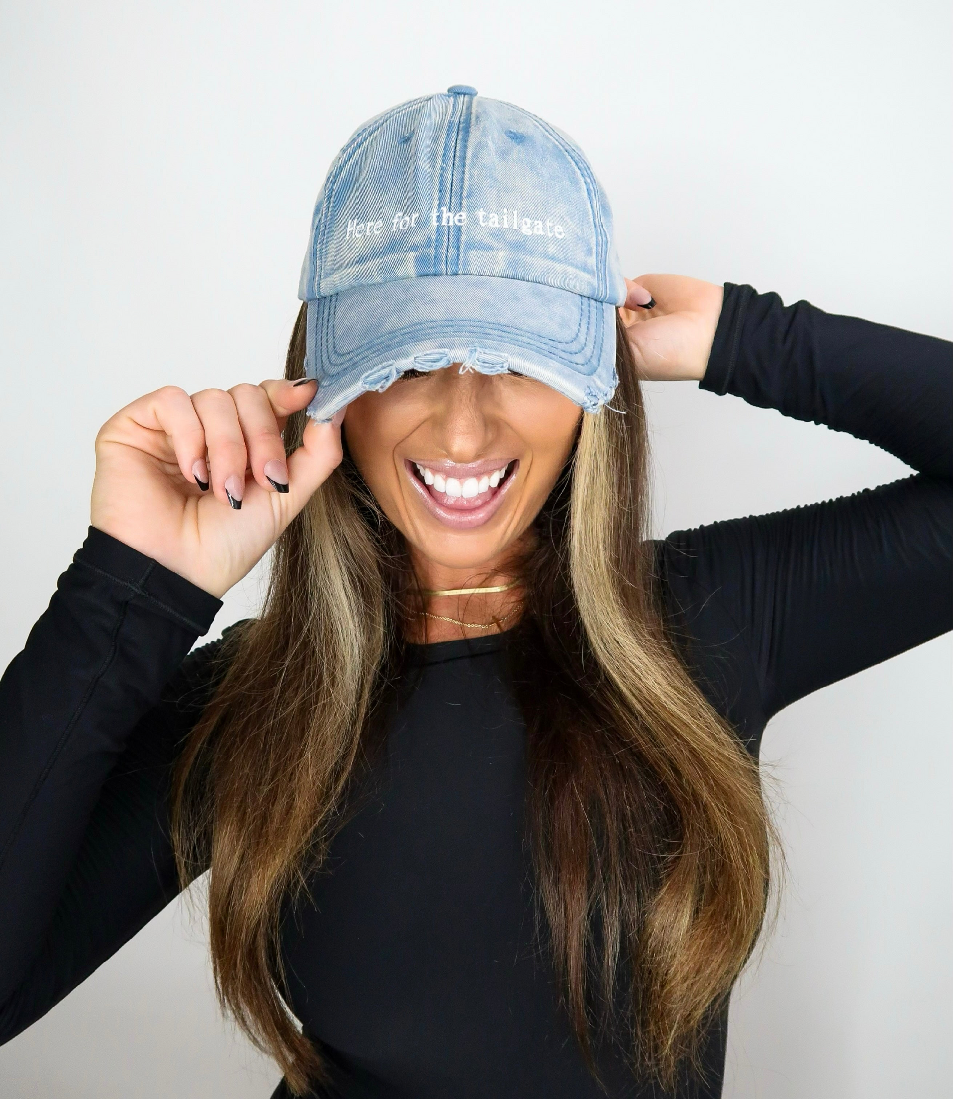 Sporty Here for the tailgate hat in acid wash blue distressed denim good for football game outfit on model Eileen Hayman
