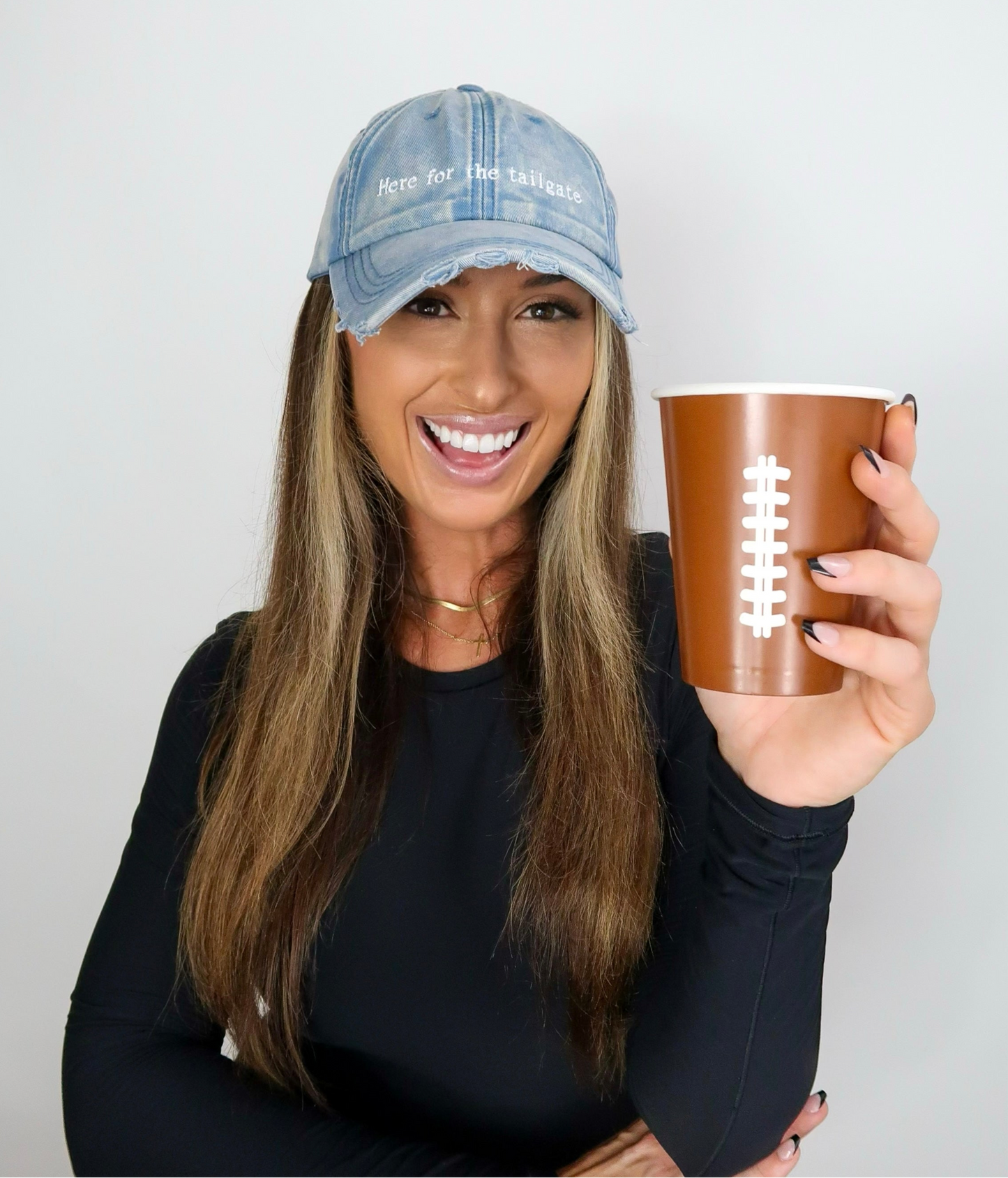 Sporty Here for the tailgate hat in acid wash blue distressed denim good for football game outfit on model Eileen Hayman
