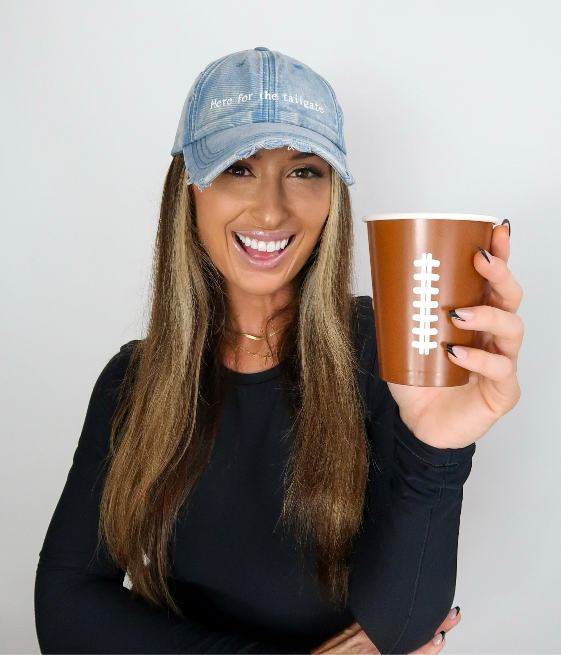 Sporty Here for the tailgate hat in acid wash blue distressed denim good for football game outfit on model Eileen Hayman