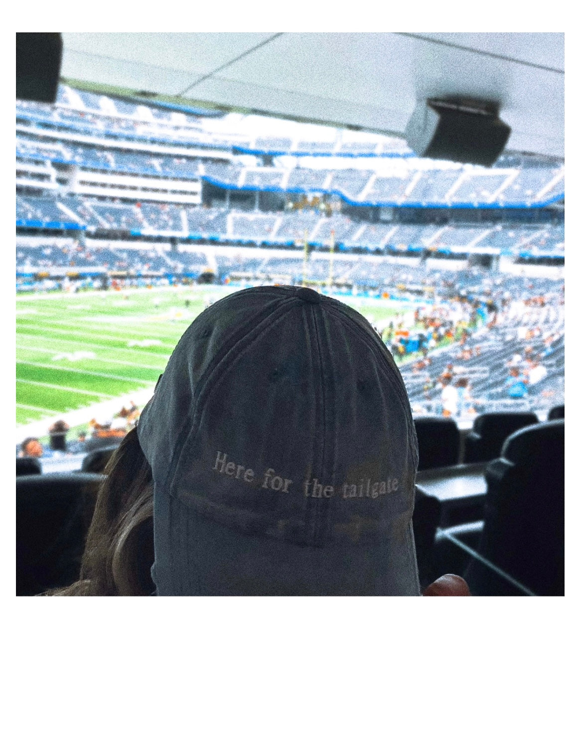 model Eileen Hayman wearing Here for the Tailgate blue hat at football game