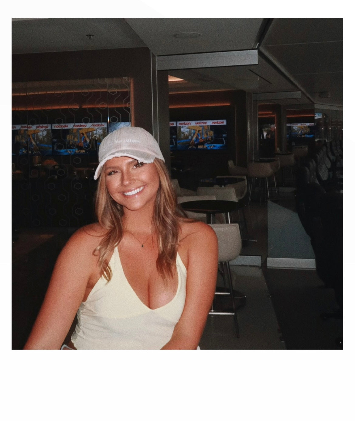 model Paige wearing Here for the Tailgate beige hat at football game