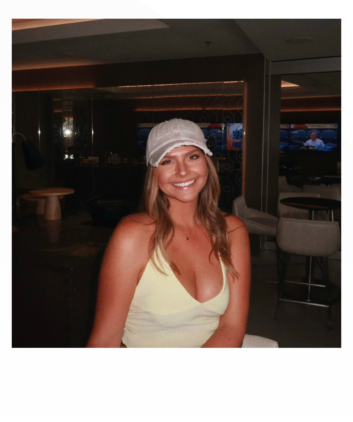 model Paige wearing Here for the Tailgate beige hat at football game